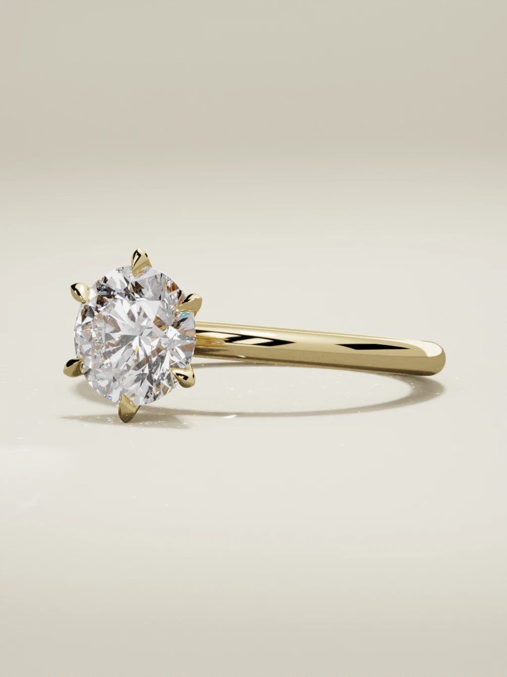 The Alba, solitario con diamante redondo de laboratorio en oro amarillo 14K, vista de tres cuartos