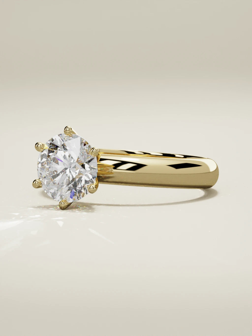 The Fina, solitario con diamante redondo de laboratorio en oro amarillo 14K, vista de tres cuartos