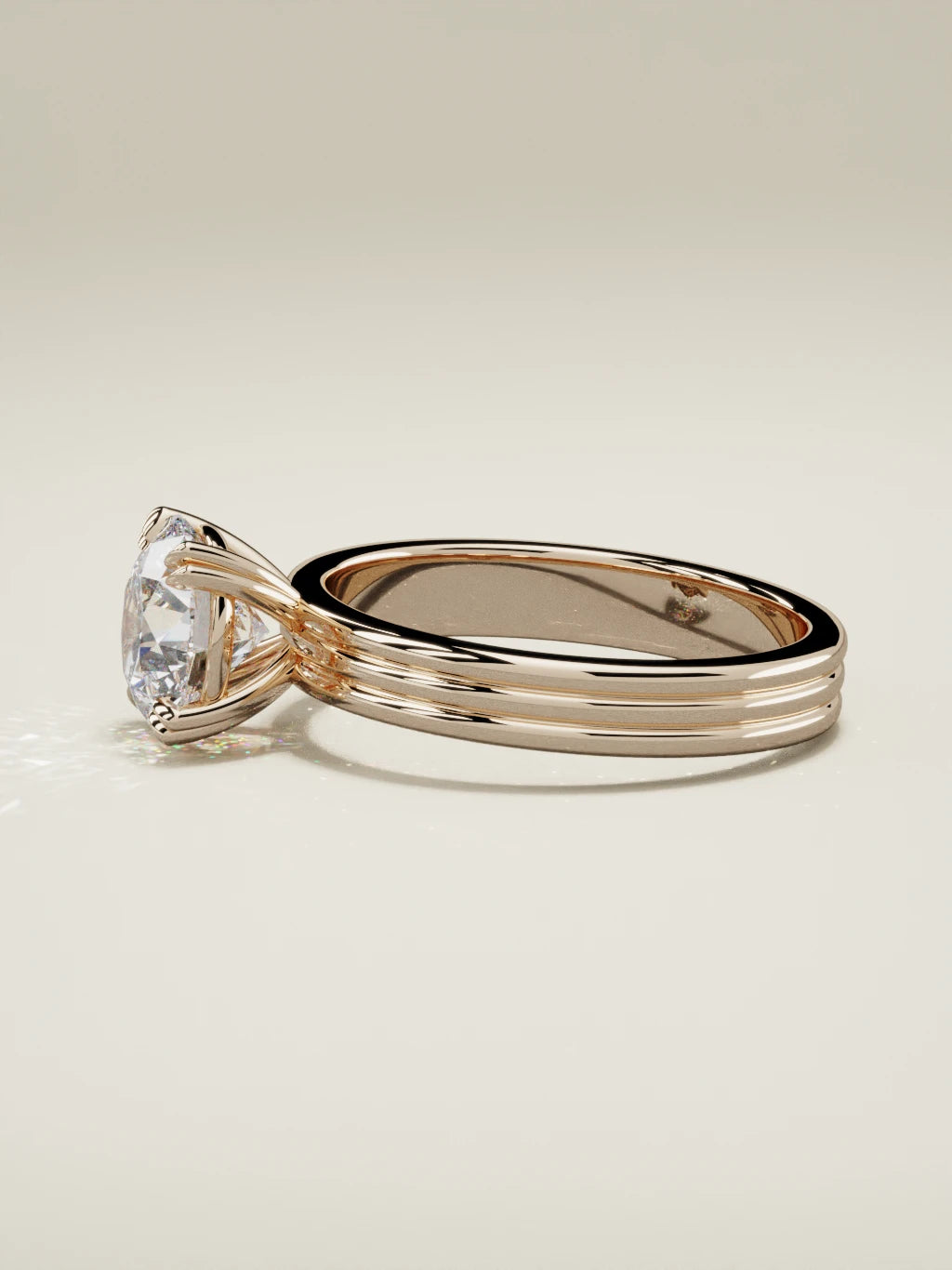 The Lira, solitario con diamante redondo de laboratorio en oro rosa 14K, vista lateral