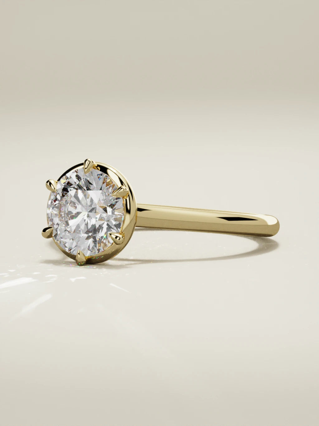 The Orbe, solitario con diamante redondo de laboratorio en oro amarillo 14K, vista de tres cuartos