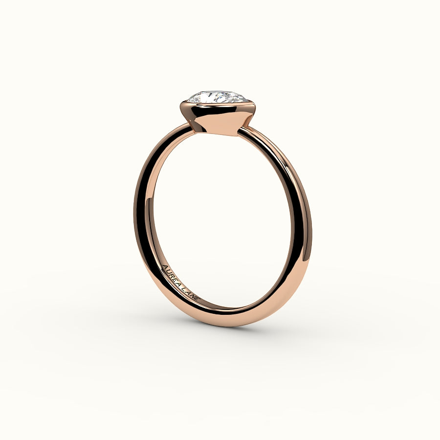 East-West Pear Cut Bezel Ring Setting