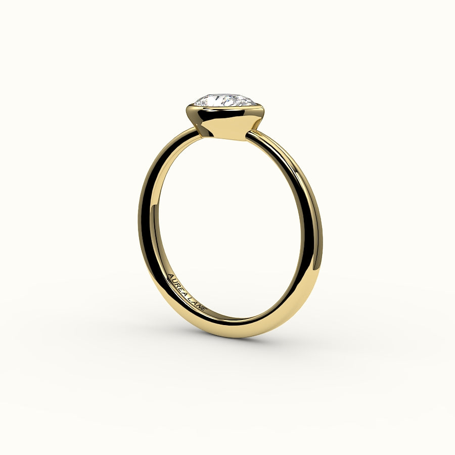 East-West Pear Cut Bezel Ring Setting